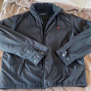 Polo jacket. Black on black. Waterproof, packable hood.